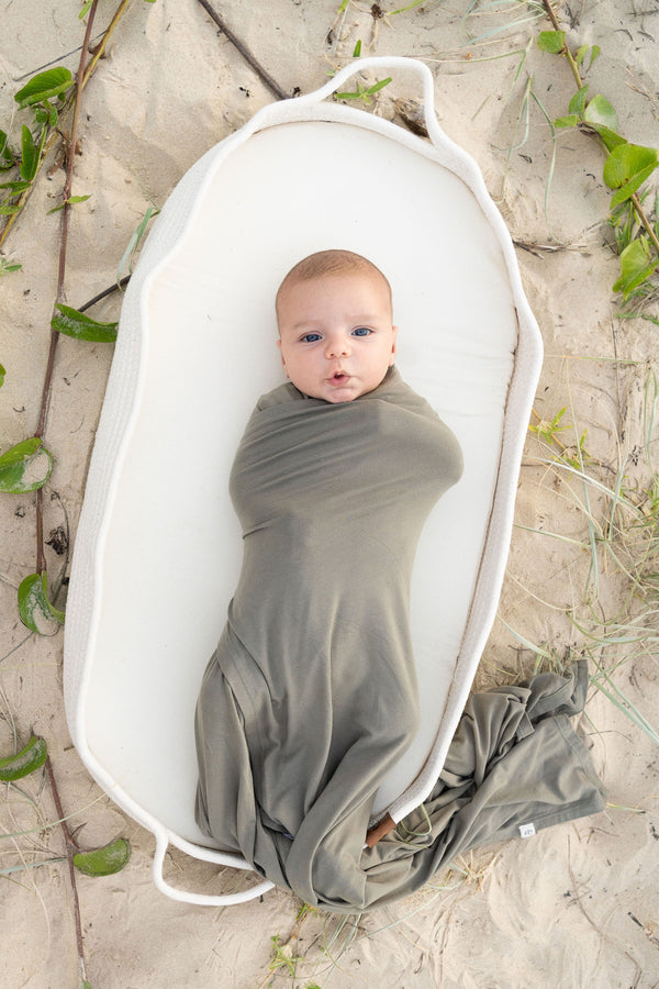 Newborn bamboo swaddle blanket in olive | Essentially Bub